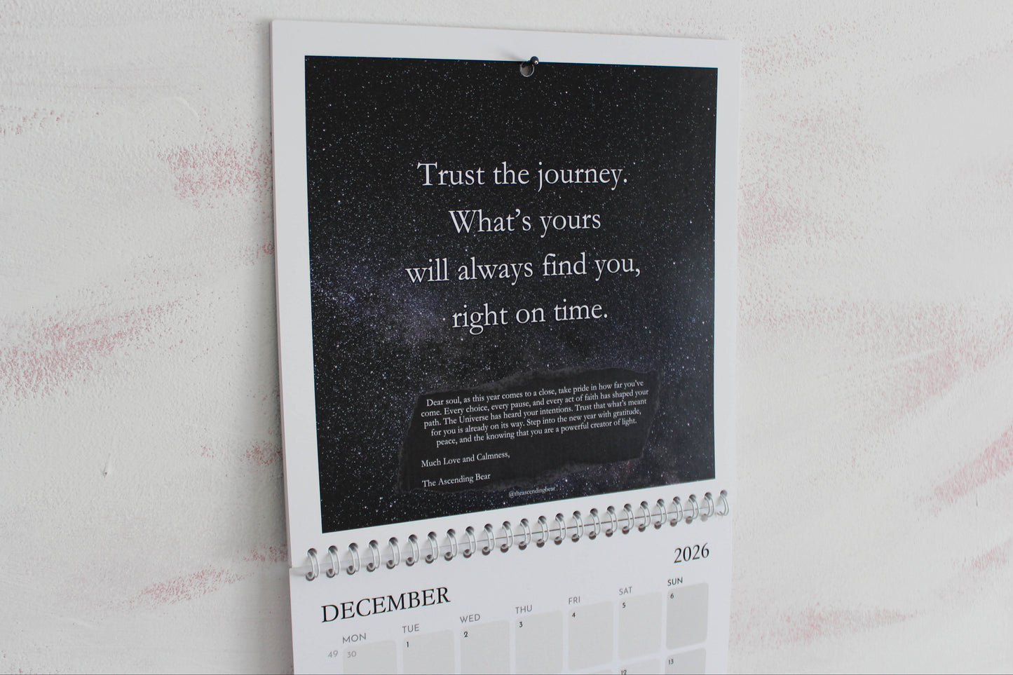 Monthly guidance calendar with celestial art and affirmations
