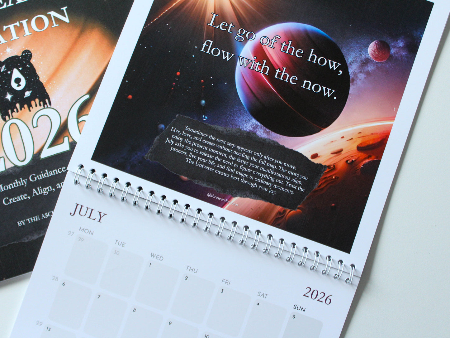Manifestation wall calendar with monthly intentions and affirmations