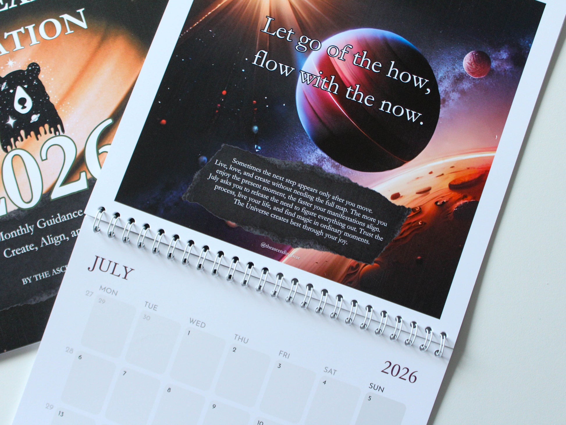 Manifestation wall calendar with monthly intentions and affirmations